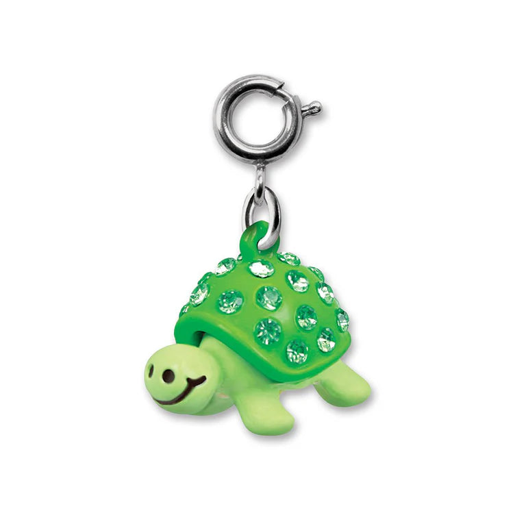 Green turtle charm with crystal details on a white background