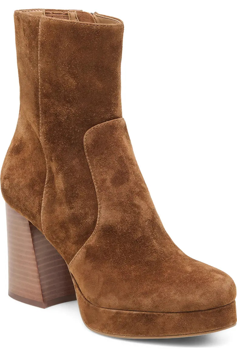 A brown suede ankle boot with a chunky wooden-look block heel and platform sole, shown from a three-quarters angle on a white background.