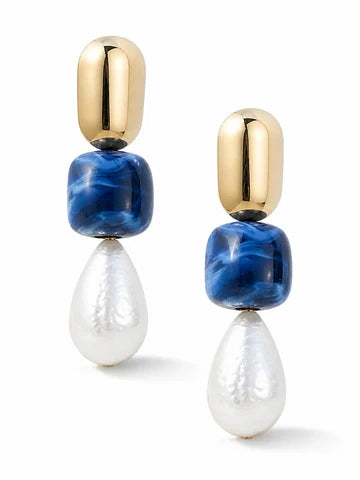 A pair of drop earrings featuring polished gold capsule-shaped studs, a round blue marbled bead, and a teardrop-shaped white pearl, shown on a clean white background.