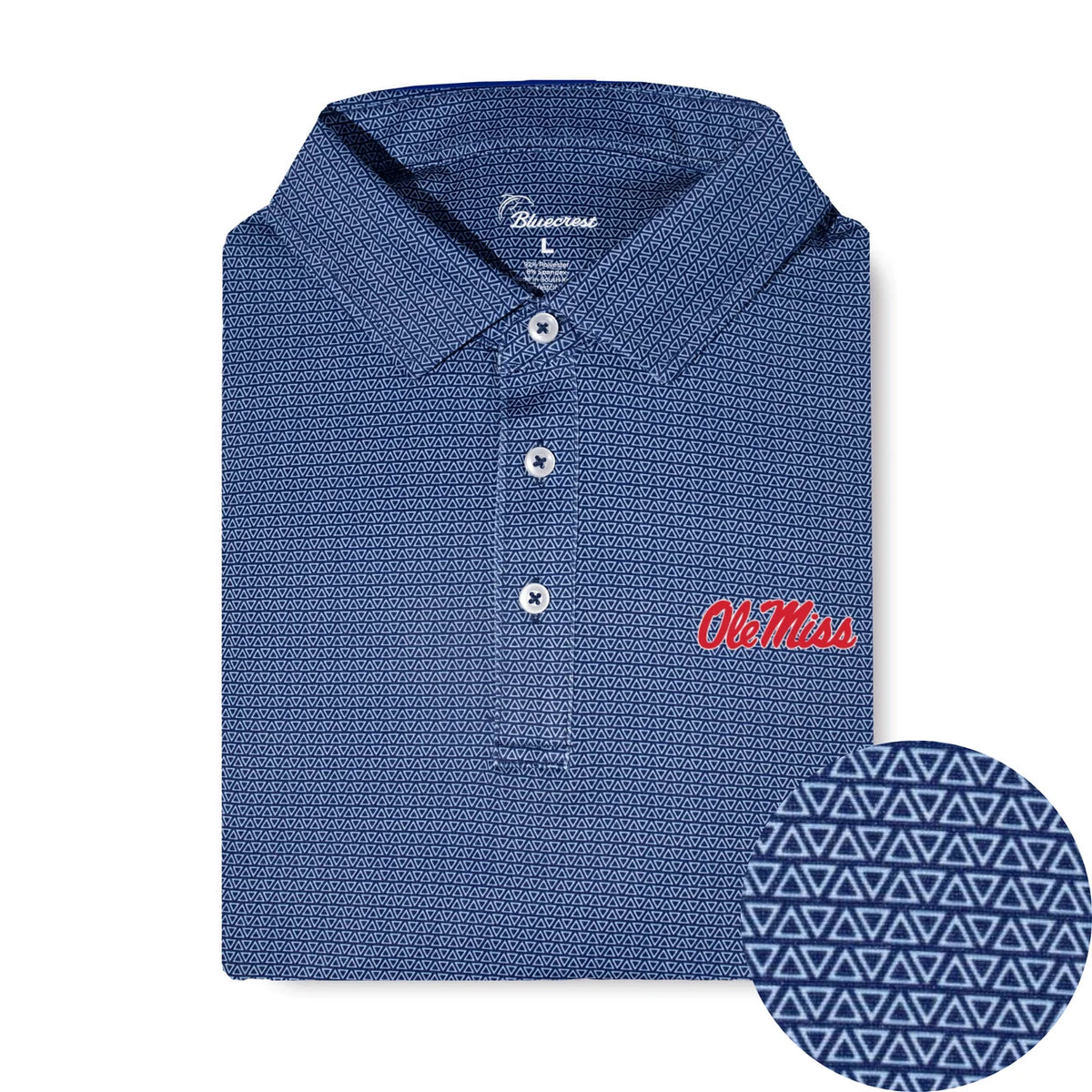 A folded blue patterned polo shirt with white buttons and a red embroidered 'Ole Miss' logo on the chest, shown on a white background with a circular detail inset of the fabric pattern.