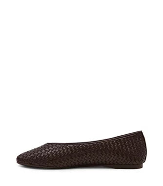 Pair of black quilted loafers on a white background