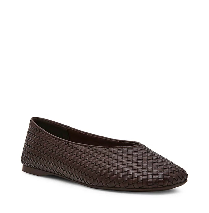 Black shoes with white polka dots on a white background