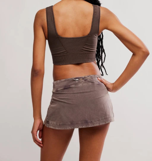 Woman modeling brown colored skirt and brown athletic top