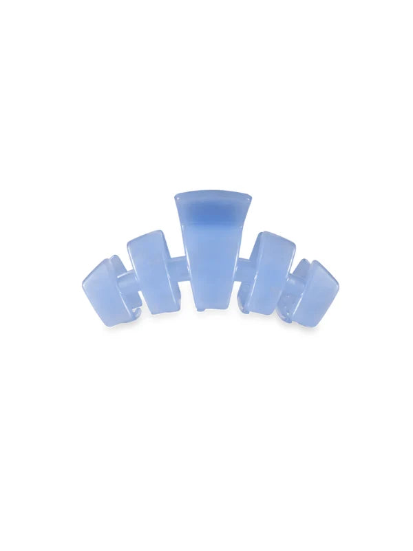 A light blue translucent hair claw clip on a solid white background.