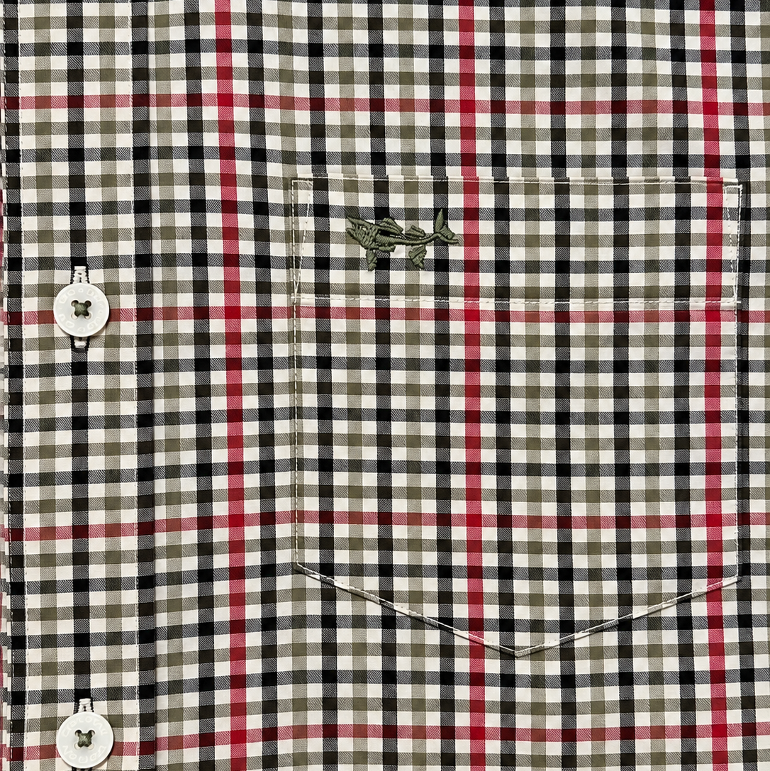 Close-up of a plaid button-up shirt fabric with a chest pocket and a small embroidered Burberry logo.