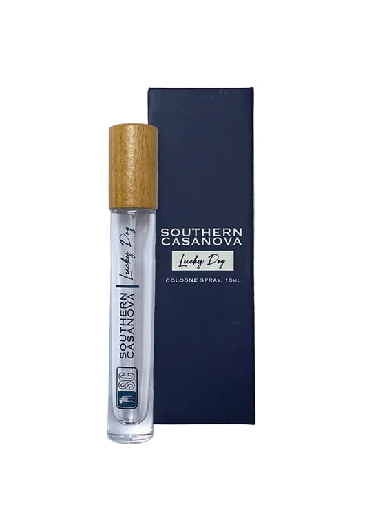 Southern Casanova 'Lucky Dog' cologne spray 10ml rollerball bottle with a light wood cap, shown next to its dark navy blue packaging box on a white background.