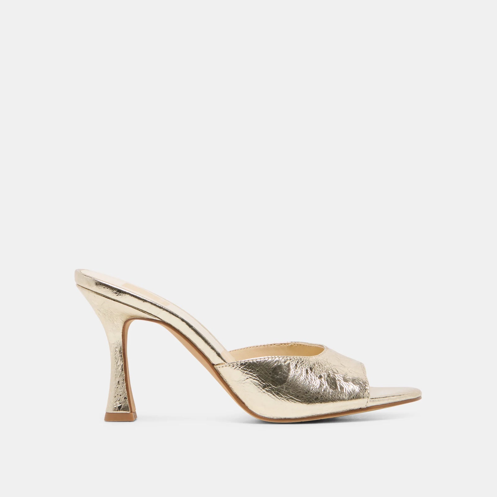 Gold high-heeled shoe on a white background