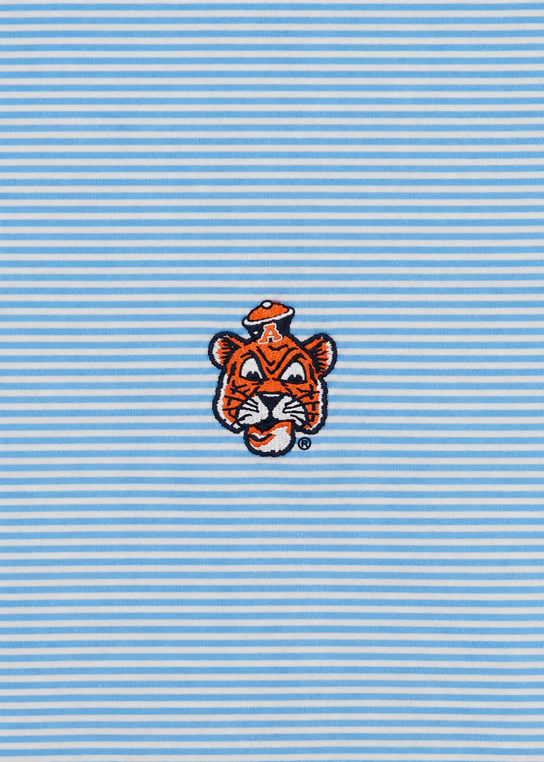A close-up of a light blue and white horizontally striped fabric featuring an embroidered tiger mascot logo in orange, black, and white at the center.