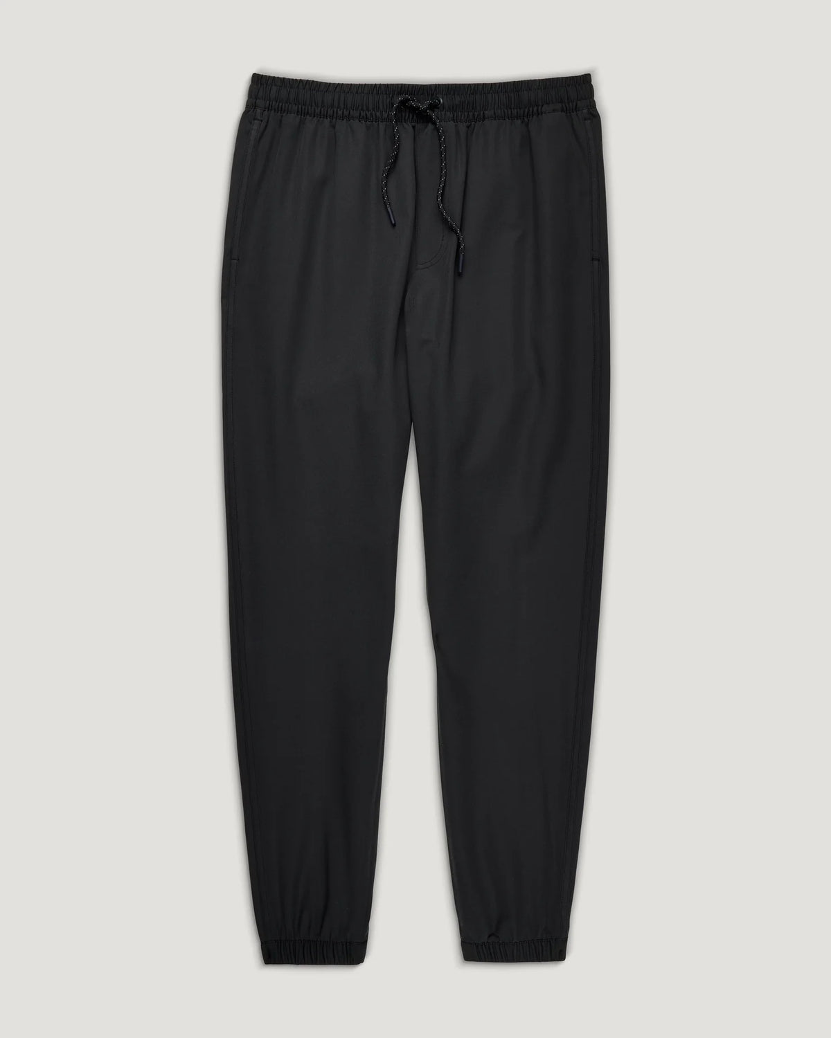 Black pants with drawstring on a light gray background