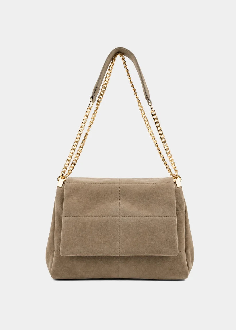 Taupe suede shoulder bag with gold chain strap and front flap pocket.