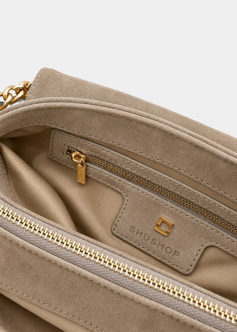 Inner view of a taupe purse with pockets