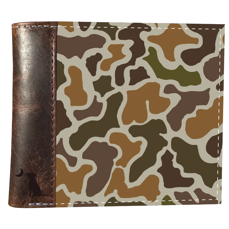 A bifold wallet with a brown faux-leather front and a camouflage patterned back, featuring a dark brown leather side panel with a dog silhouette and crescent moon.