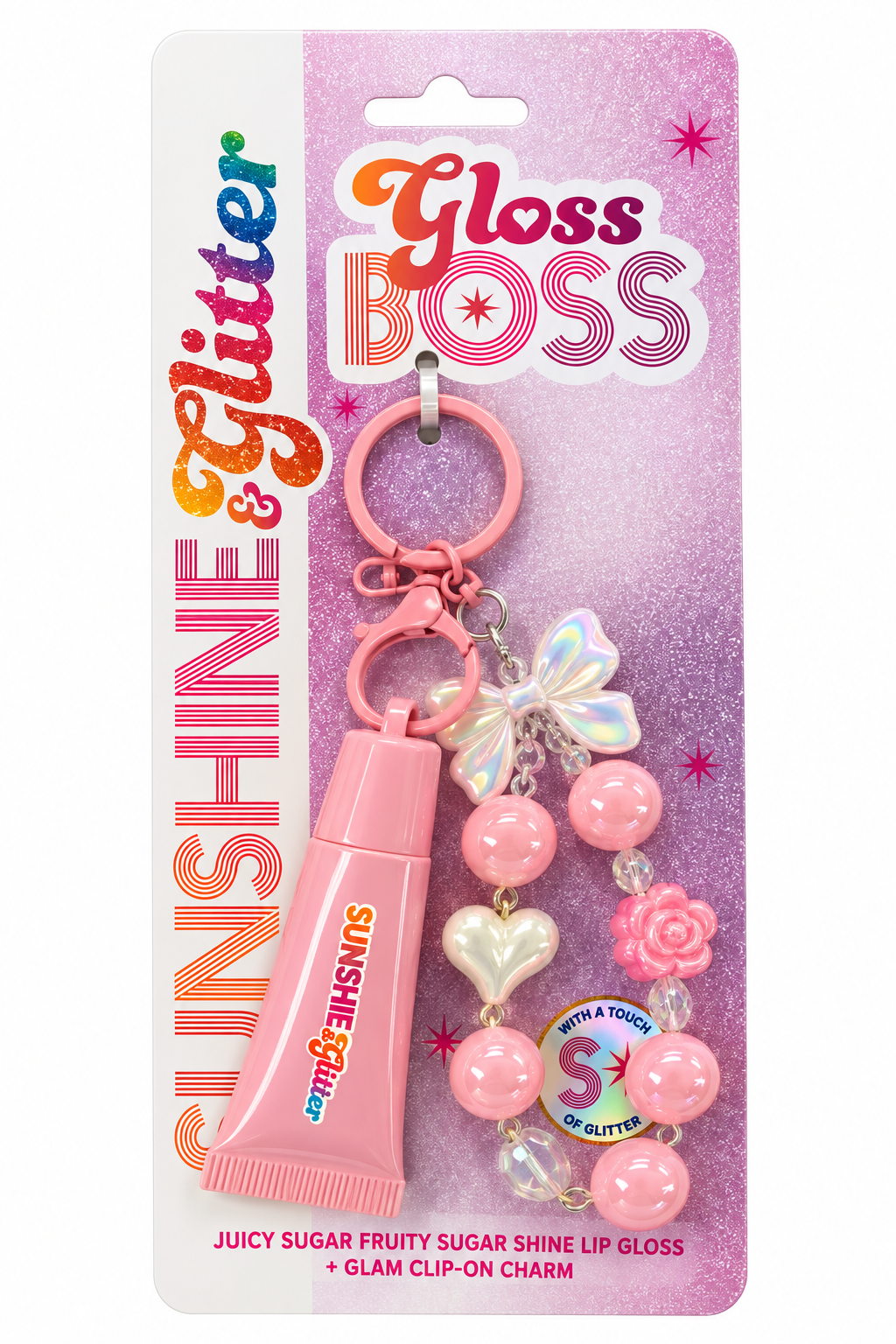 Sunshine & Glitter Gloss Boss lip gloss and glam clip-on charm set in pink packaging. The set includes a pink tube of lip gloss and a matching pink beaded charm with a butterfly, heart, and flower.