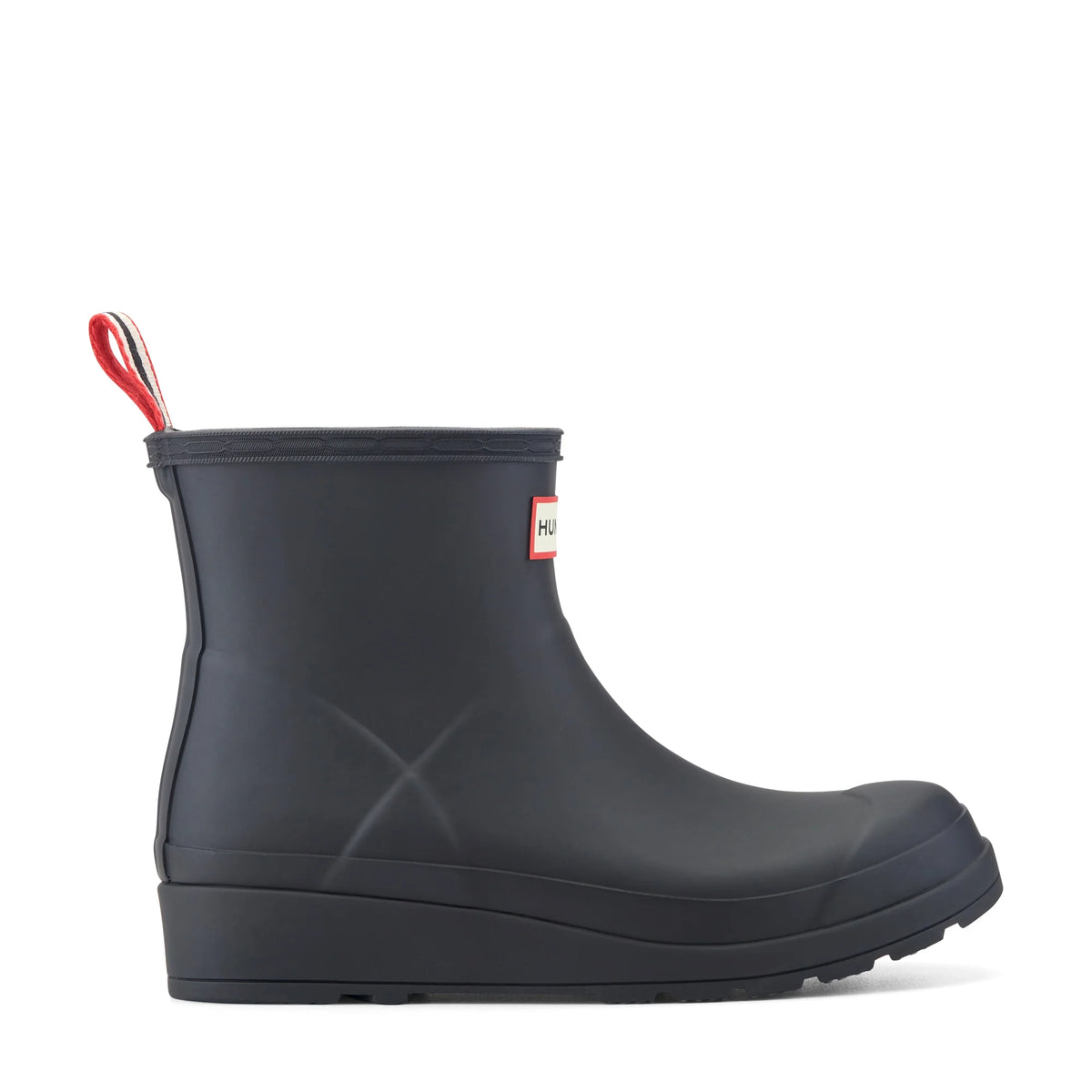 A single Hunter rain boot in matte black, featuring a pull loop with red, white, and black stripes on the back, a small red and white Hunter logo patch on the side, and a thick black sole, shown against a plain white background.
