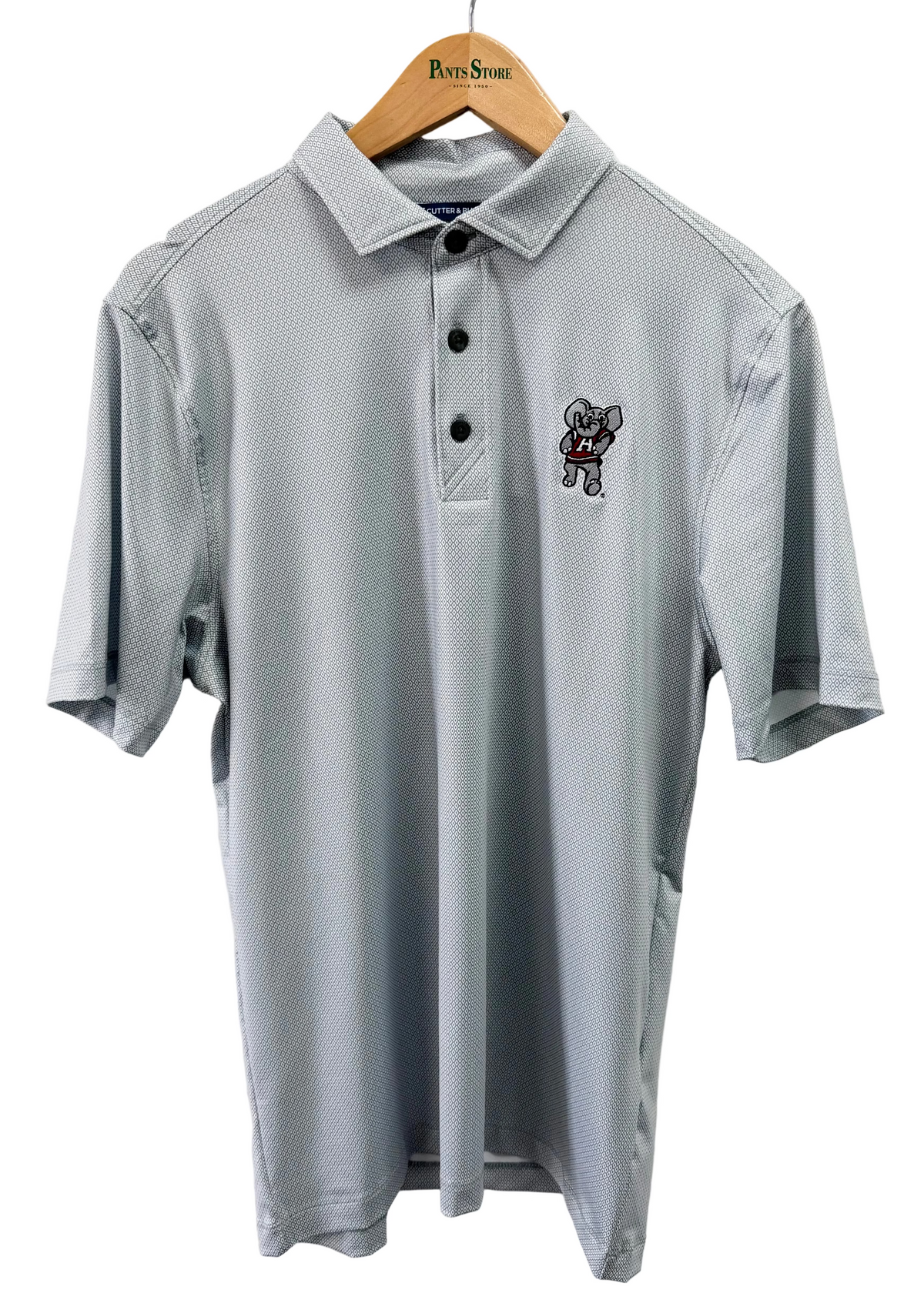 A light gray short-sleeve polo shirt with a small embroidered cartoon dog logo on the left chest, hanging on a wooden hanger with 'Port & Son' printed on it against a plain white wall.