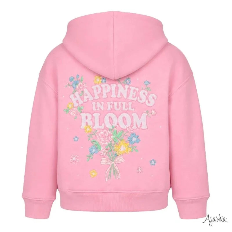 A pink hooded sweatshirt shown from the back, featuring a colorful floral graphic and the text 'HAPPINESS IN FULL BLOOM' in white. The brand name 'Azorkia' is visible in a script watermark in the bottom right corner.