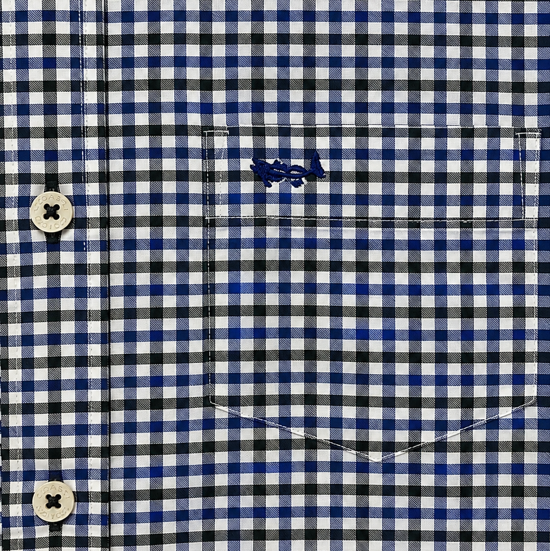 Close-up of a blue, black, and white gingham checkered shirt with a chest pocket and embroidered logo.