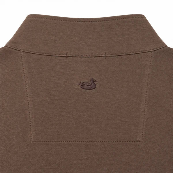 Close-up of the back collar of a brown knit polo shirt, featuring a small embroidered duck logo centered below the collar.