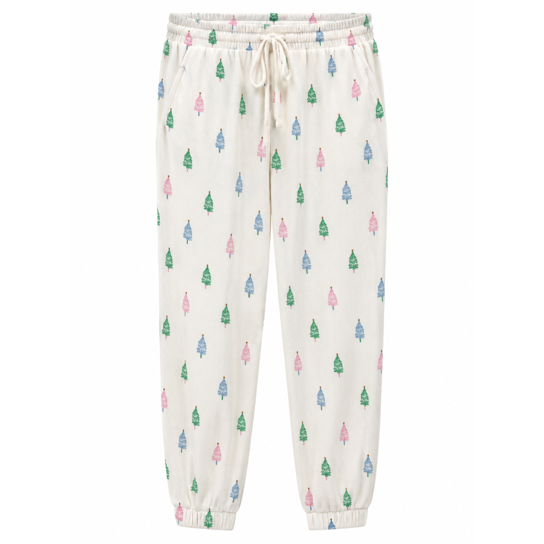 Off-white cotton pajama pants with an all-over pattern of small Christmas trees in green, pink, and blue, featuring an elastic waistband with a white drawstring and elastic cuffs.