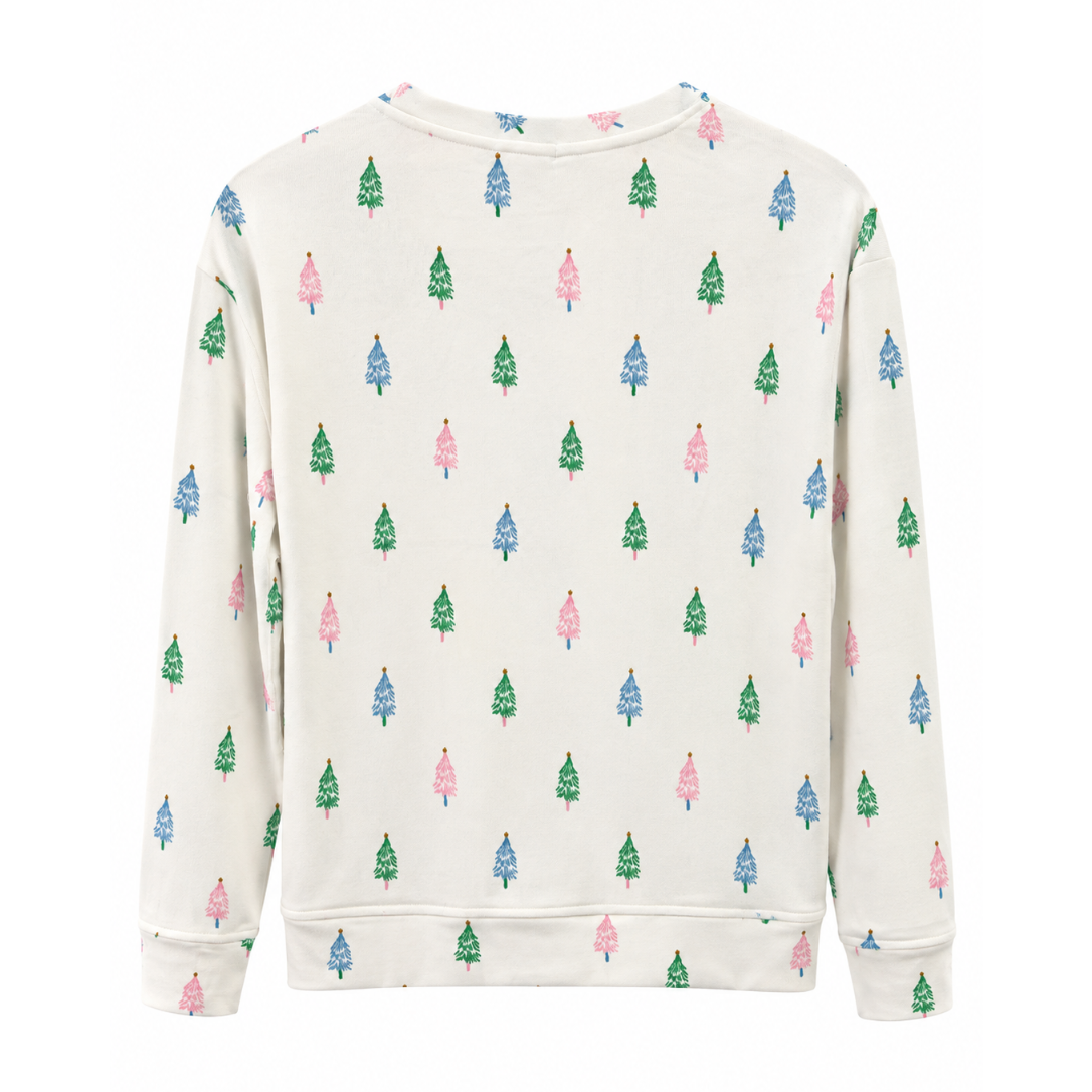 An off-white crewneck sweatshirt featuring an all-over pattern of small Christmas trees in green, blue, and pink, displayed on a clean white background.