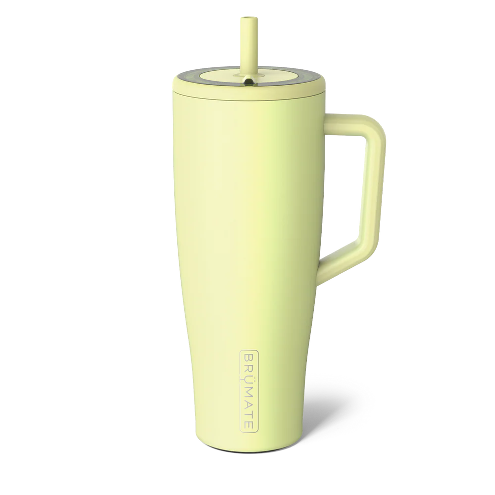 Light green mug with handle and straw lid on a white background