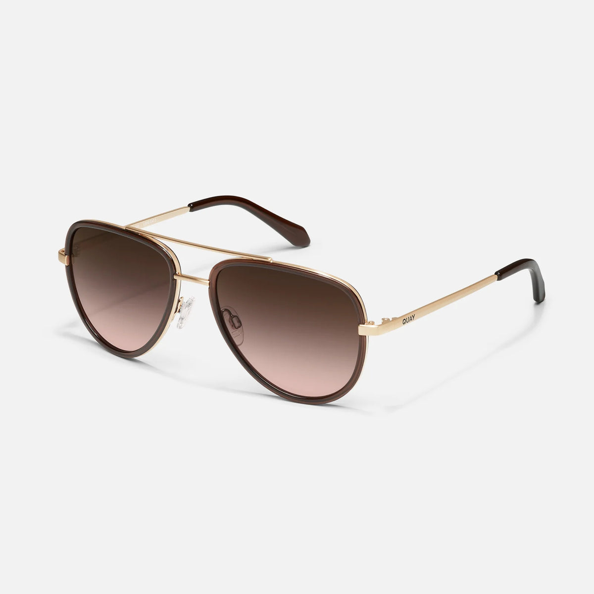 Aviator sunglasses with gold frame and brown gradient lenses on a white background