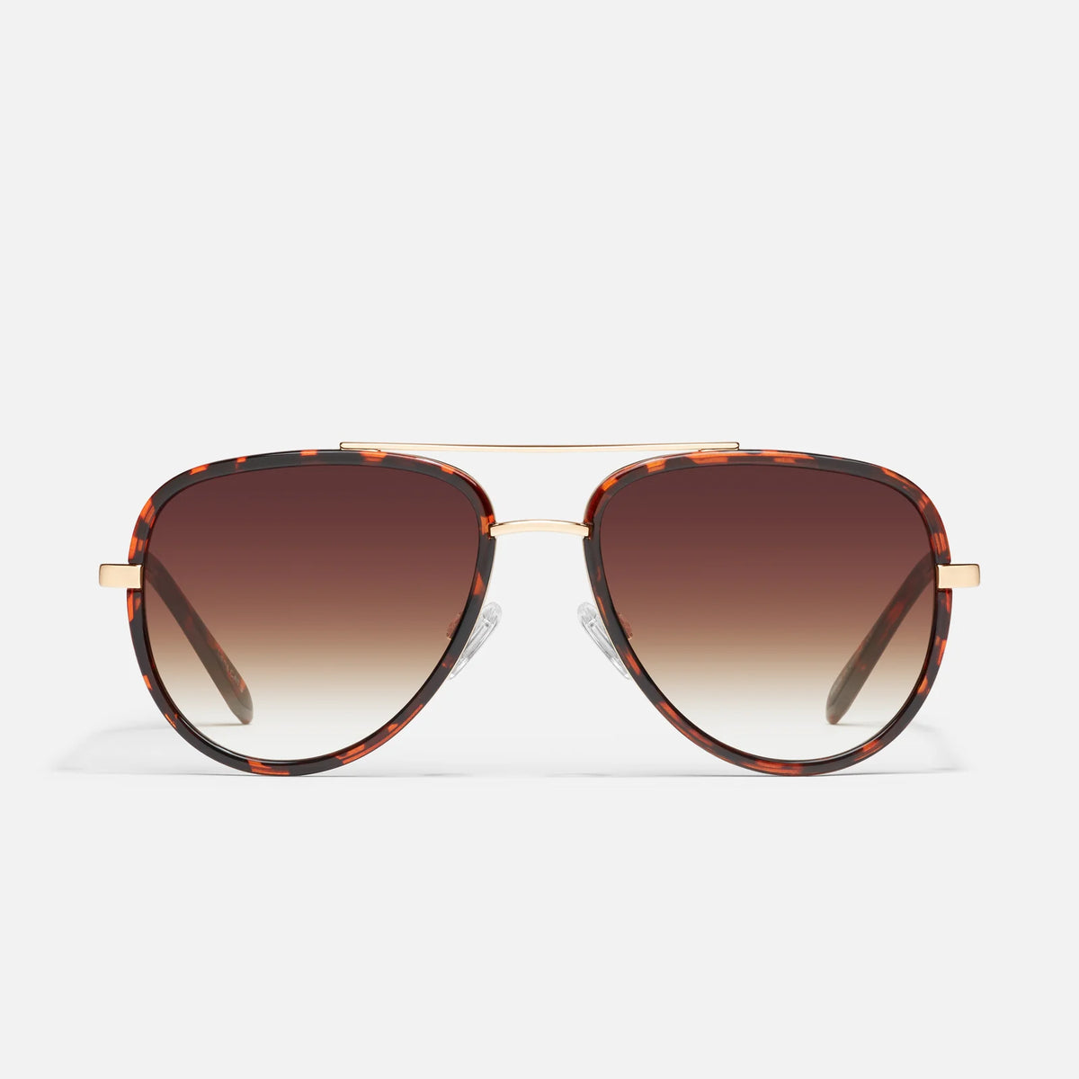 A pair of aviator-style sunglasses with a tortoiseshell frame and gradient brown lenses, shown against a clean white background.