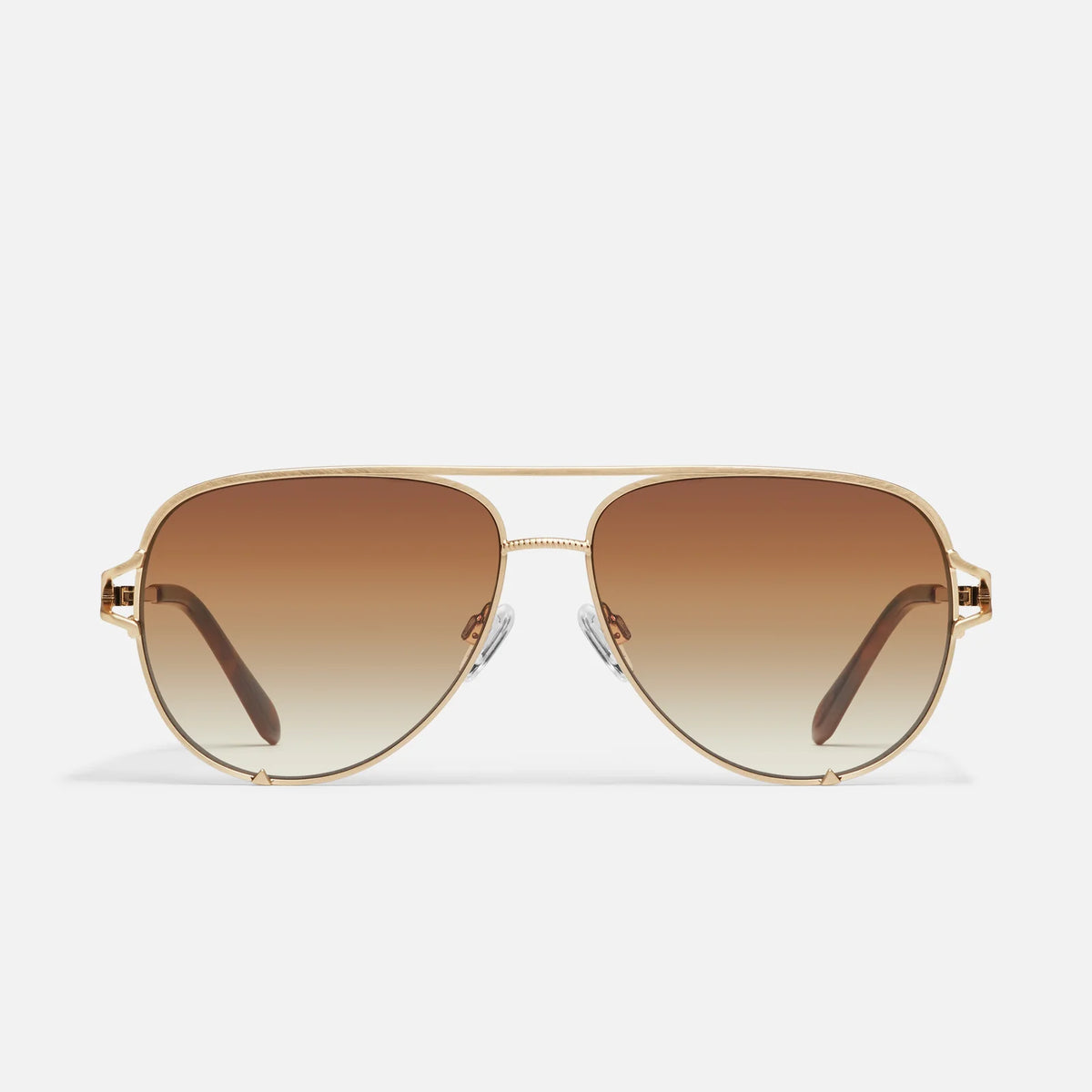 Gold-framed sunglasses with brown gradient lenses on a white background