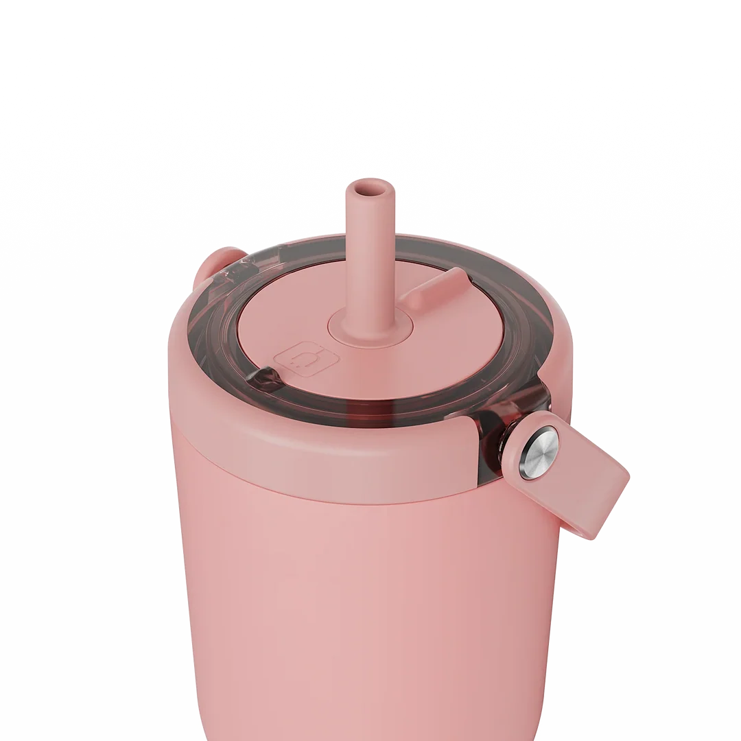 Close-up of a pink insulated tumbler with a clear lid, straw, and flip spout detail on a white background.