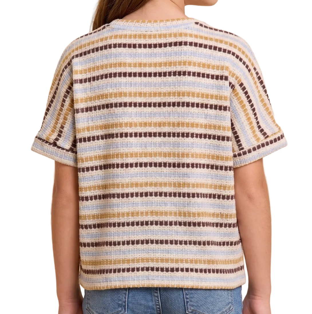 A person wearing a short-sleeve knit top with horizontal stripes in cream, tan, and dark brown, shown from the back against a plain white background.