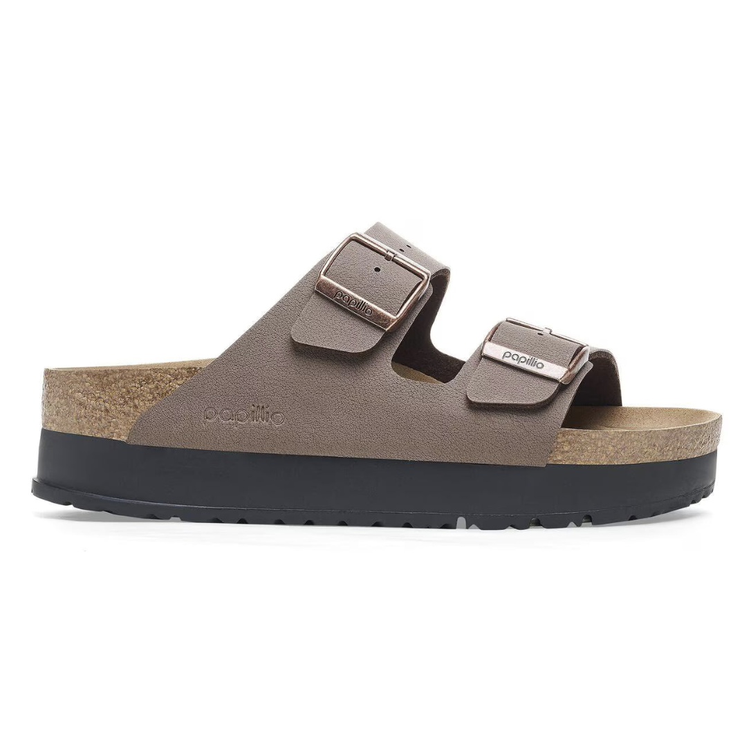 Brown sandal with black sole on a white background