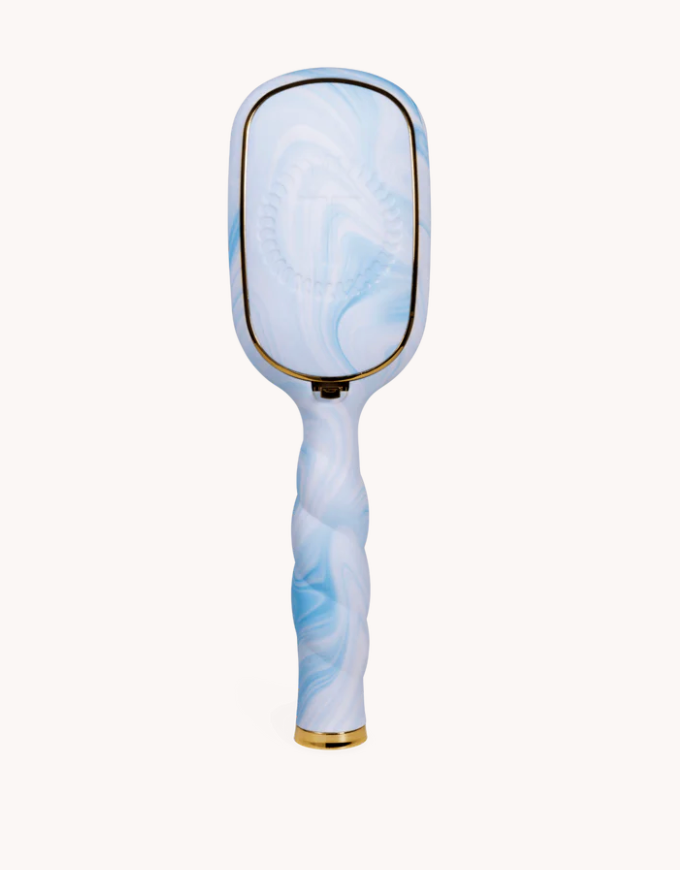 blue patterned hairbrush on a white background
