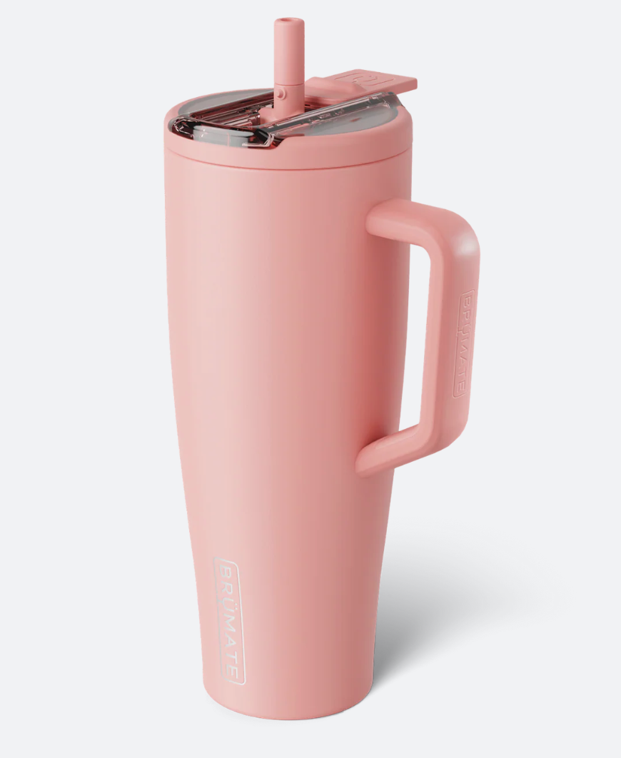 A dusty pink vacuum-insulated tumbler with a handle, lid, and straw, shown on a light gray background.