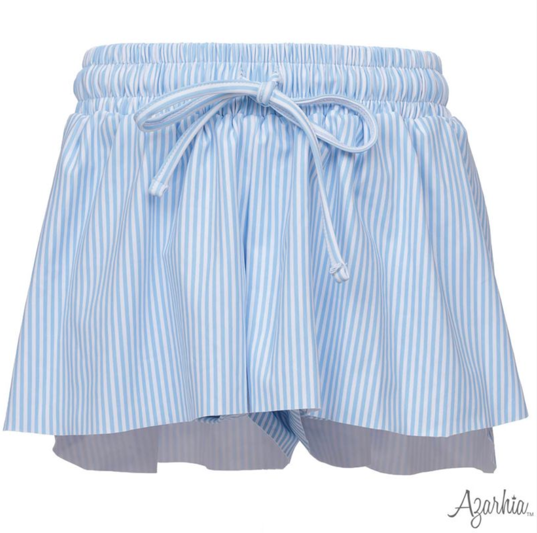 Light blue and white vertically striped ruffled shorts with an elastic waistband and drawstring, shown on a white background with the Azorkia logo in the bottom right corner.