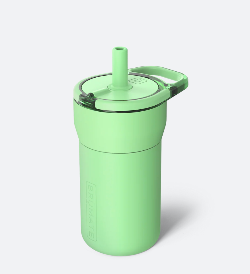 A mint green insulated travel tumbler with a matching lid, flip-top straw, and carrying loop, shown on a light gray background.