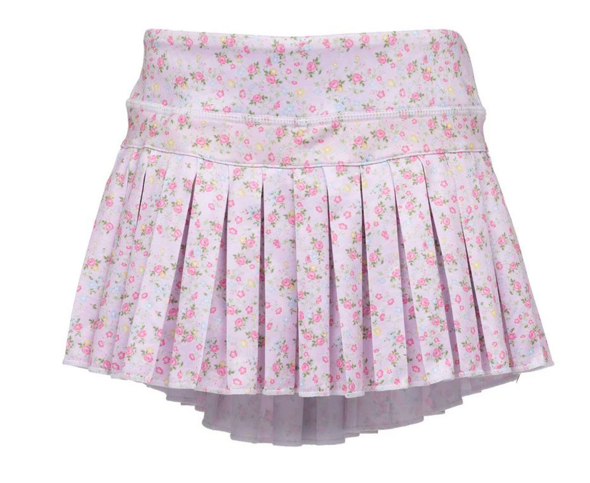 A light pink pleated mini skirt with a small pink and yellow floral print, shown against a plain white background.