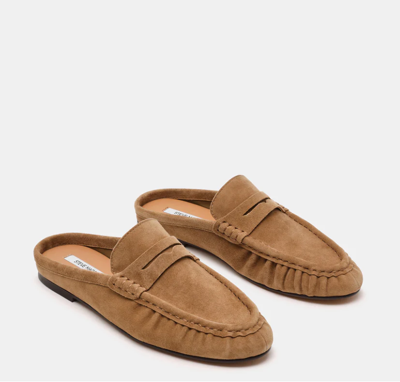 A pair of tan suede penny loafers shown from the side and back on a light gray background.