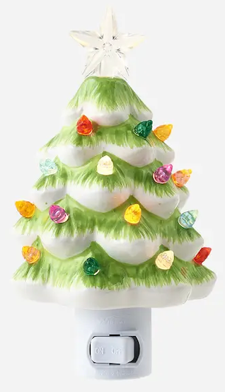 Green ceramic Christmas tree night night.