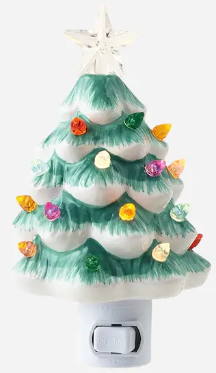 Dark green ceramic Christmas tree night night.