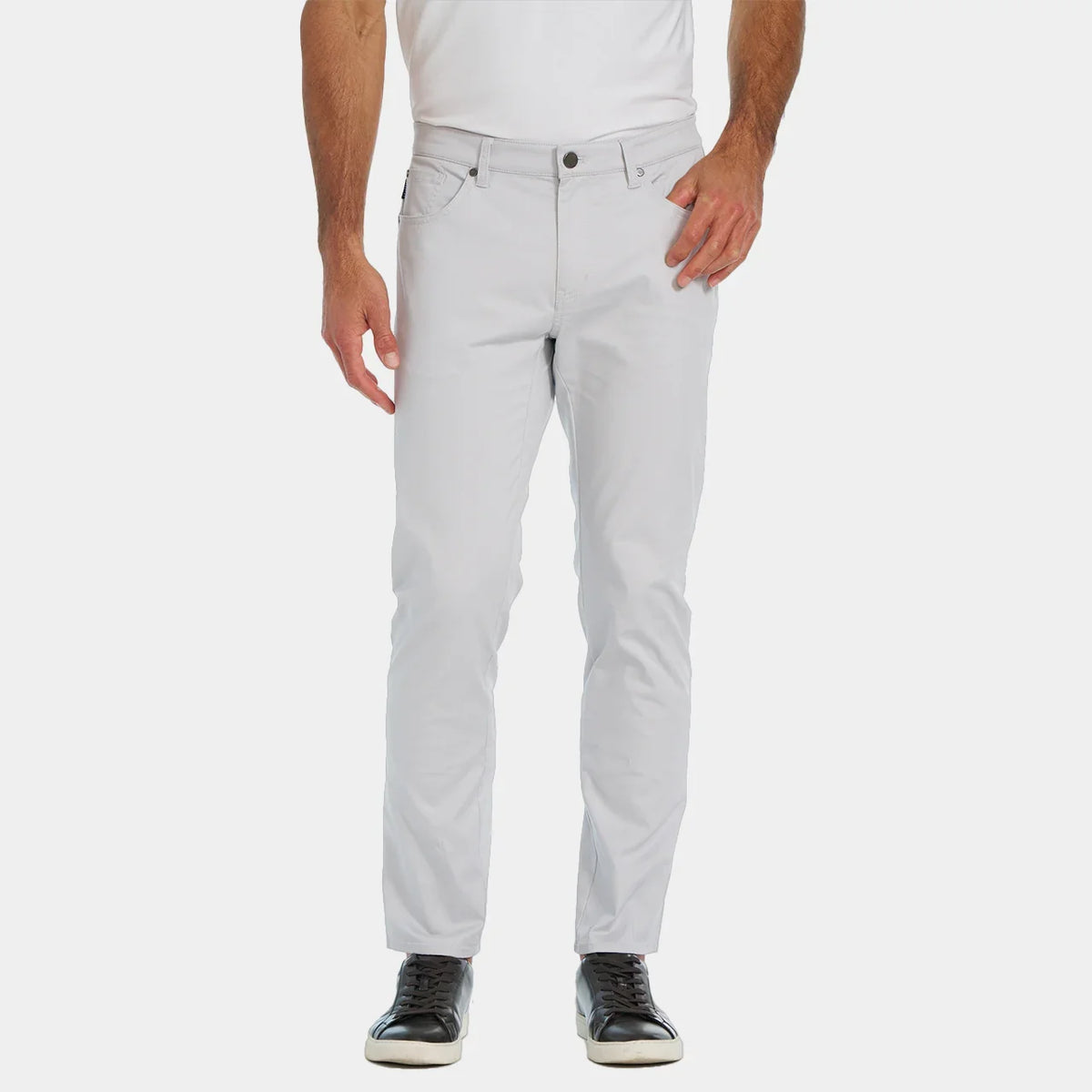 Light gray pants worn by a person on a white background