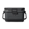 A dark gray YETI cooler with black handles and a black lid, shown from a front-facing perspective on a clean white background.