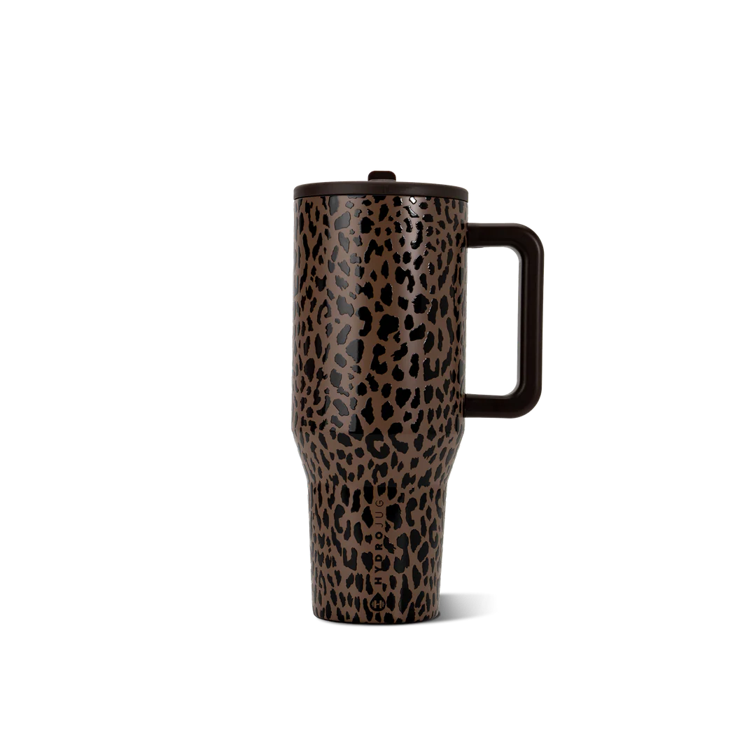A travel tumbler with a brown and black leopard print pattern, featuring a dark brown handle and lid, shown on a solid white background.