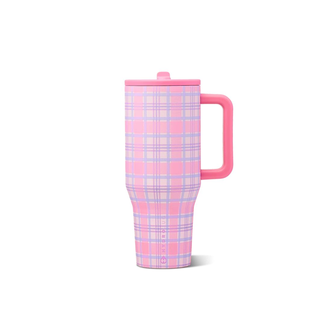A pink and lavender plaid insulated travel tumbler with a matching pink lid and handle, shown on a clean white background.