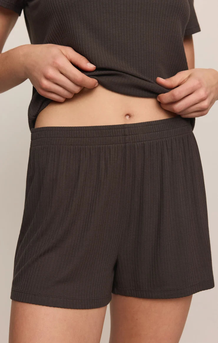 woman modeling brown ribbed shorts with elastic waistband