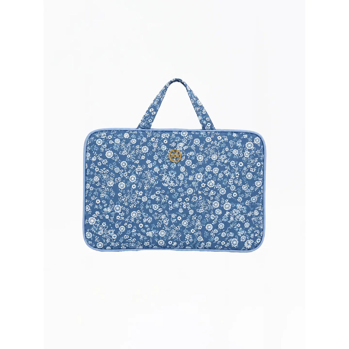 A blue laptop sleeve with a white floral pattern and a small gold logo on the front, featuring two top handles, set against a plain white background.