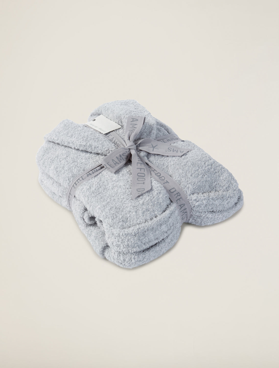  gray fuzzy robe on a beige background