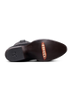 The outsole view of a dark brown leather boot, showing the brand name 'TECOVAS' printed in orange on the toe area and a black heel.