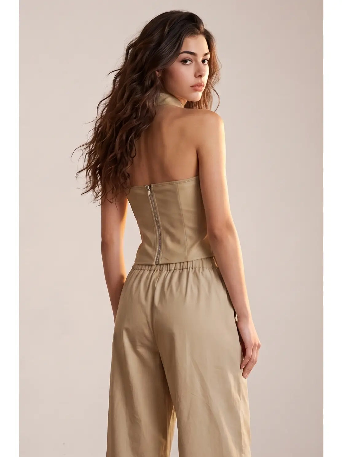 Girl wearing brown halter top and pants
