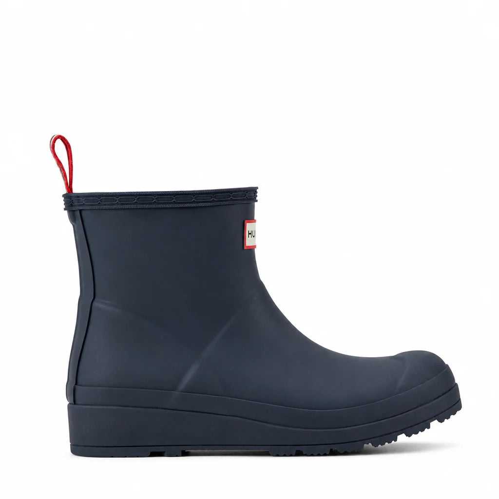A single navy blue rubber rain boot with a red pull loop and a small Hunter brand tag on the side, shown against a plain white background.