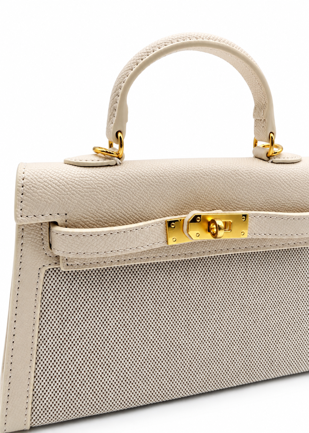 A structured top-handle handbag in light beige textured leather with a perforated front panel and gold-tone hardware, shown on a clean white background.